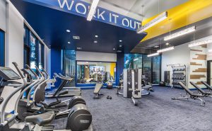 Apartments for Rent in Redwood City CA - Encore - Fitness Center with Exercise Equipment and Floor-to-Ceiling Windows